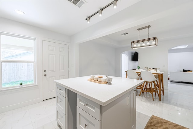 kitchen featuring a center island and pendant lighting