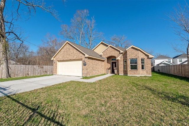 view of front of home featuring a front yard and a garage