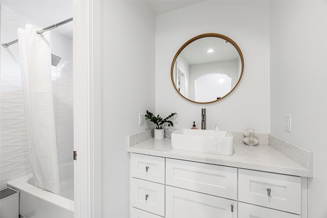 bathroom with vanity and shower / bath combo