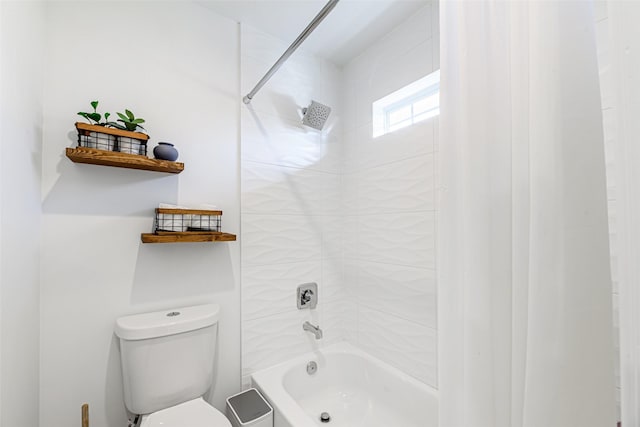 bathroom with shower / tub combo with curtain and toilet