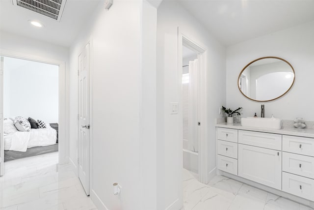 bathroom featuring shower / bathtub combination with curtain and vanity