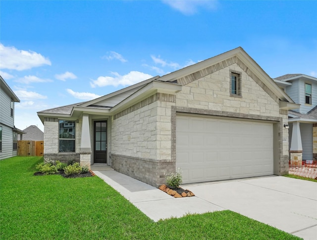 view of front of house with a garage and a front yard