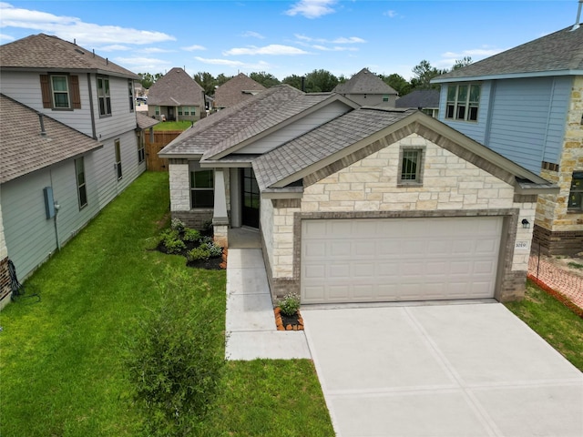 view of front facade featuring a garage and a front lawn