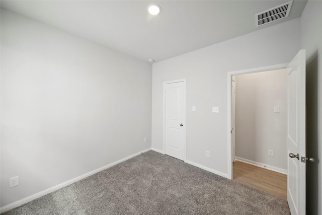 unfurnished bedroom featuring carpet