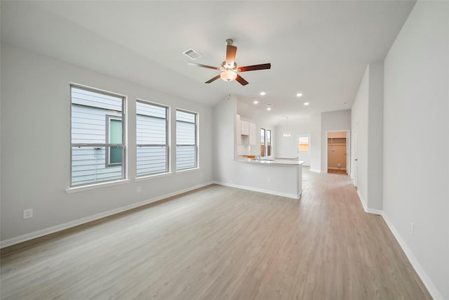 unfurnished living room featuring ceiling fan and light wood-type flooring