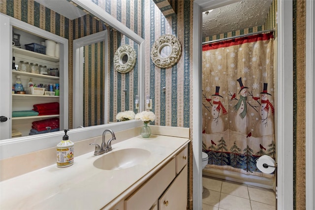 bathroom with tile patterned floors, vanity, toilet, and a shower with shower curtain