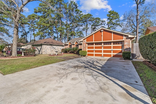 view of front of house featuring a garage and a front yard