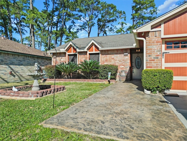 exterior space featuring a garage and a front lawn