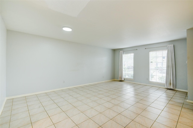 unfurnished room featuring light tile patterned floors