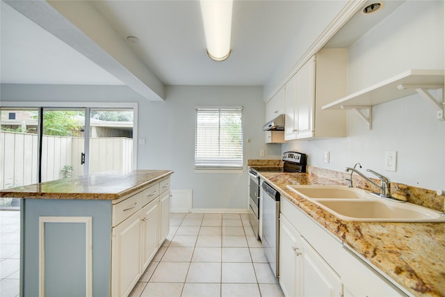 kitchen with white cabinetry, sink, light tile patterned floors, a kitchen island, and appliances with stainless steel finishes