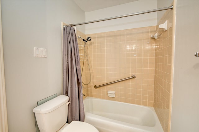 bathroom featuring toilet and shower / bath combo with shower curtain