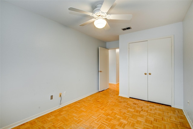 unfurnished bedroom featuring ceiling fan and light parquet floors