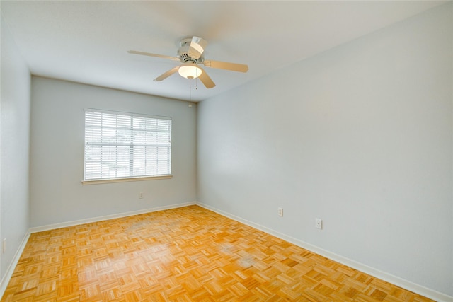 unfurnished room featuring ceiling fan and light parquet flooring