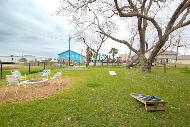 view of yard with an outdoor fire pit