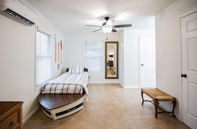 bedroom featuring an AC wall unit, ceiling fan, and light tile patterned flooring