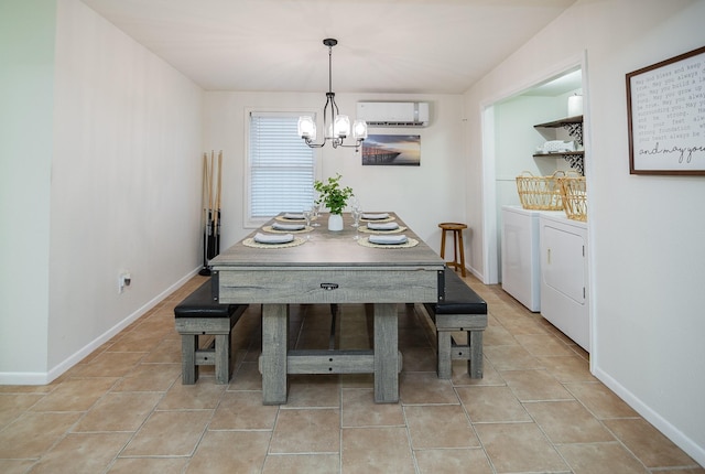 tiled dining area with a wall mounted AC, a notable chandelier, and independent washer and dryer