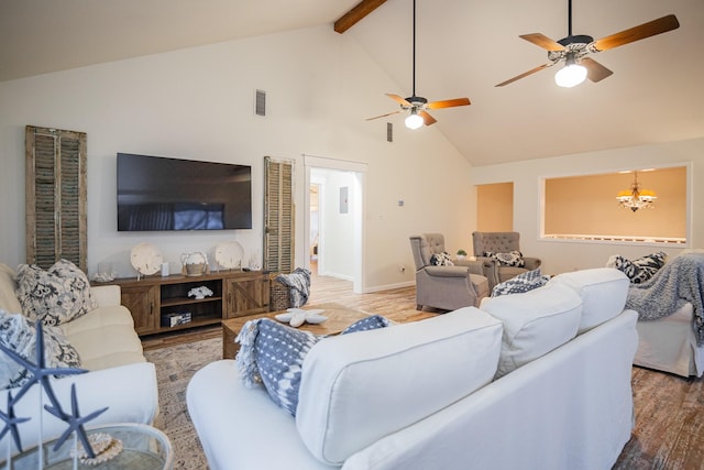 living room with beamed ceiling, hardwood / wood-style floors, ceiling fan with notable chandelier, and high vaulted ceiling