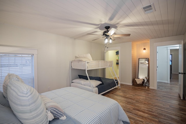 bedroom featuring ceiling fan and dark wood-type flooring