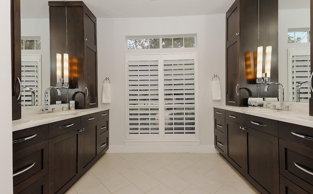 bathroom with tile patterned flooring and vanity