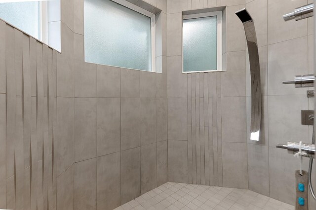 bathroom with tiled shower