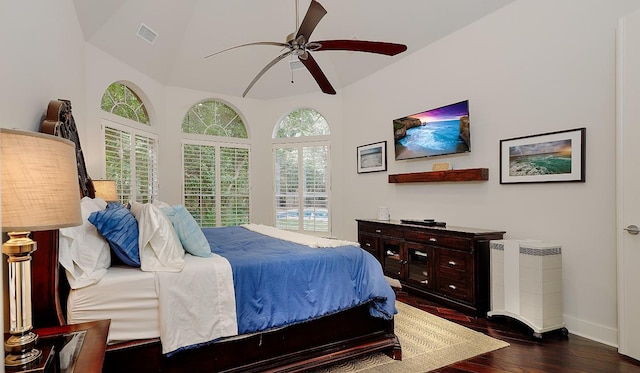 bedroom featuring vaulted ceiling, ceiling fan, and dark hardwood / wood-style floors