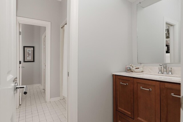 bathroom featuring tile patterned flooring and vanity