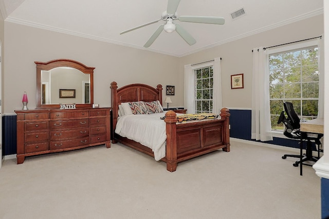 bedroom featuring ceiling fan, crown molding, and light colored carpet