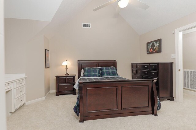 carpeted bedroom featuring ceiling fan and vaulted ceiling