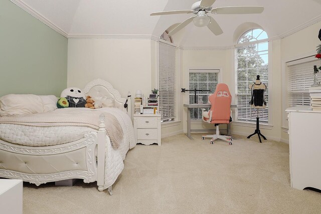 bedroom featuring ceiling fan, ornamental molding, light carpet, and vaulted ceiling