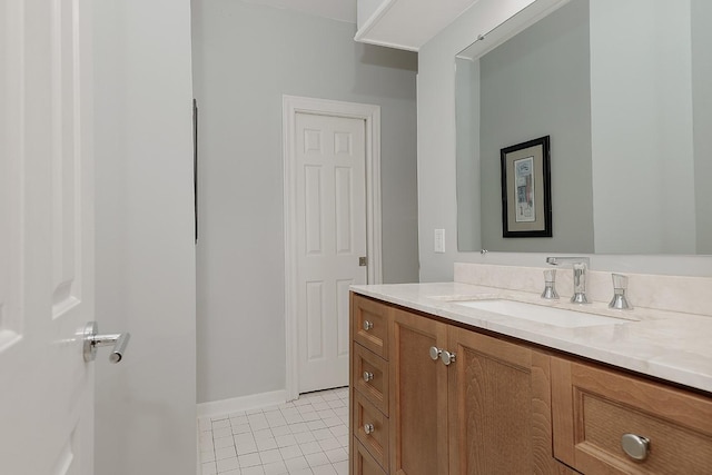 bathroom with tile patterned flooring and vanity