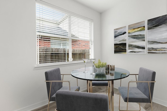 dining room with hardwood / wood-style floors