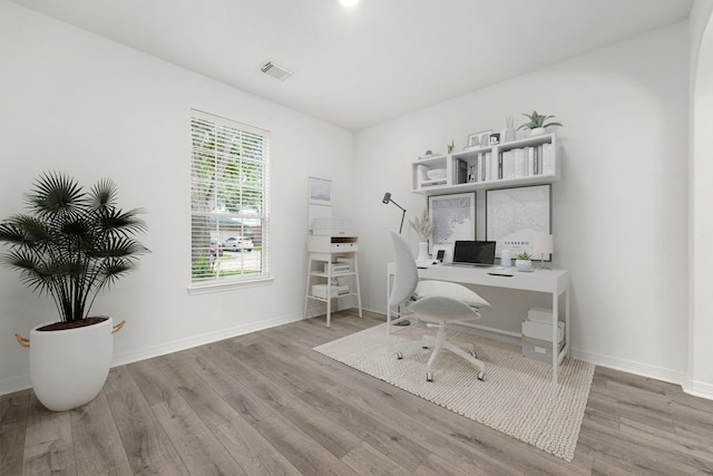 office area with light hardwood / wood-style floors