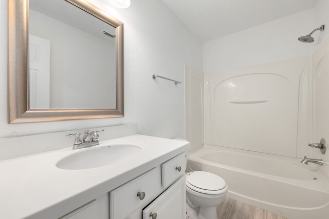 full bathroom featuring vanity, toilet, and shower / washtub combination