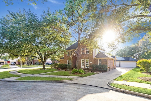 view of front of property featuring a front yard and a garage