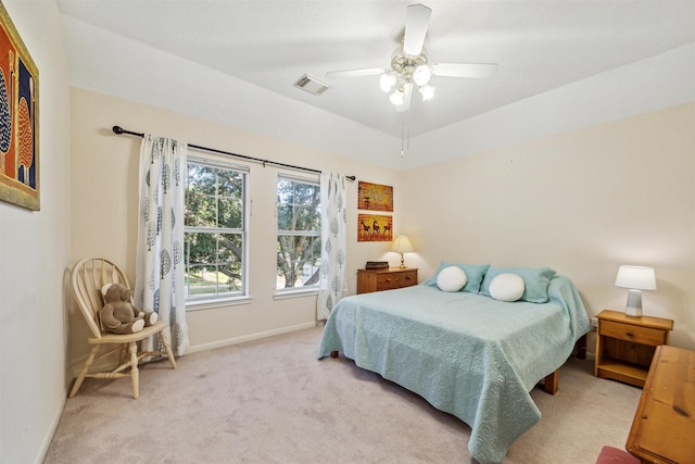 bedroom featuring light colored carpet and ceiling fan