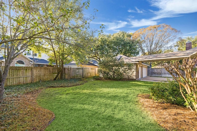 view of yard featuring a garage