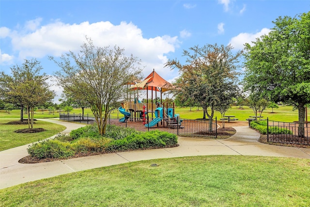 view of jungle gym with a lawn