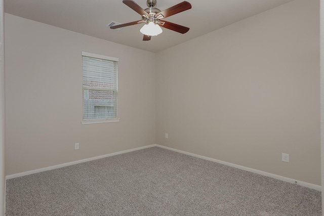 empty room featuring carpet and ceiling fan