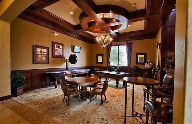 dining room with beam ceiling, coffered ceiling, an inviting chandelier, crown molding, and pool table