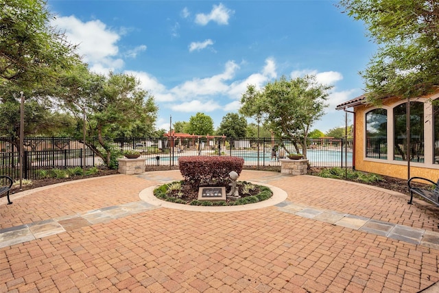 view of patio featuring a fenced in pool