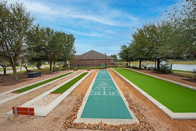 surrounding community featuring a water view