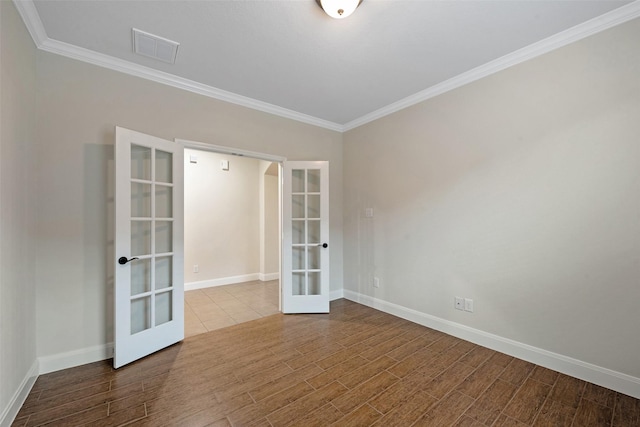 unfurnished room with french doors and crown molding