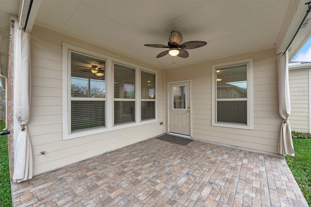 view of patio featuring ceiling fan