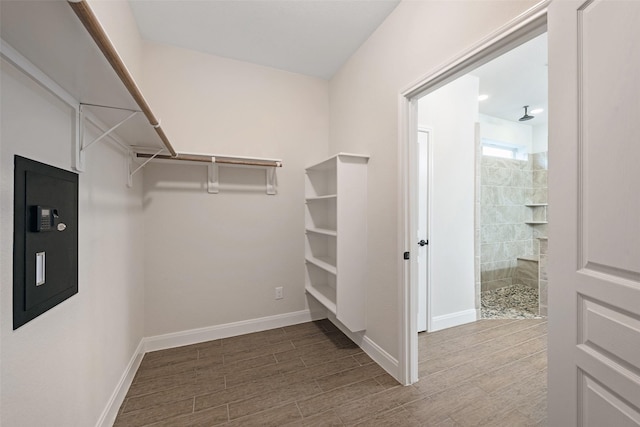 walk in closet featuring electric panel