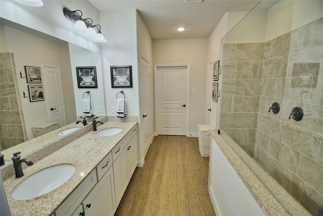 bathroom featuring hardwood / wood-style floors and vanity