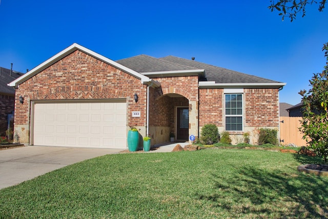 front of property featuring a garage and a front lawn