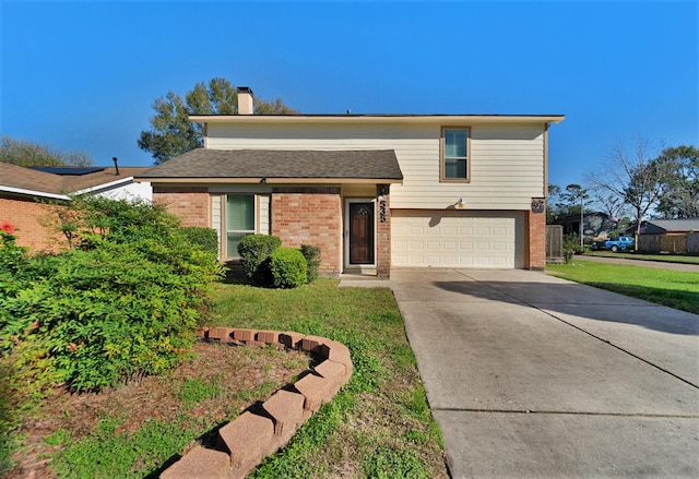 view of front of home with a garage and a front yard