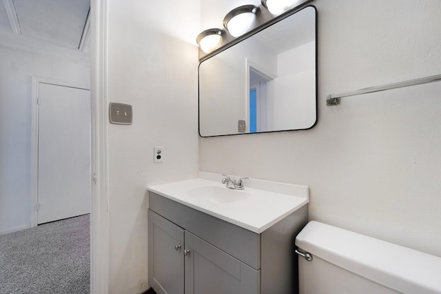 bathroom featuring vanity and toilet