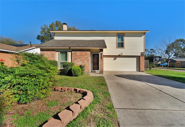 view of front facade with a front yard and a garage