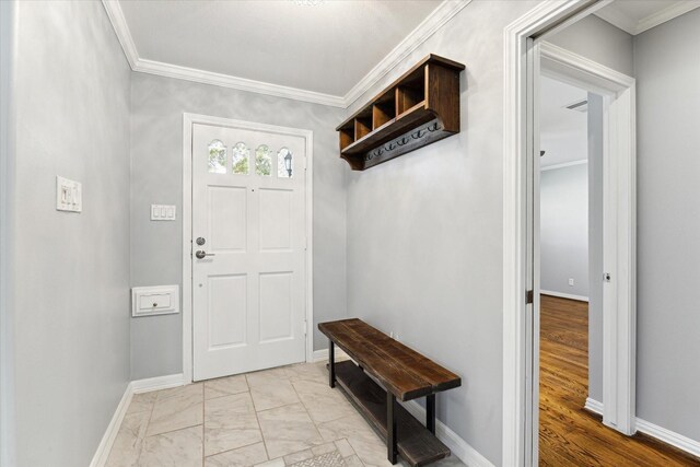 entryway with crown molding